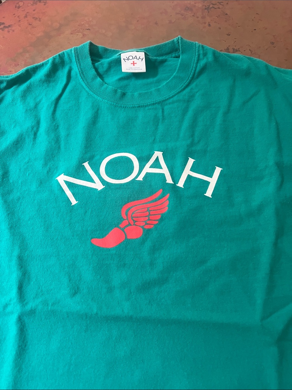 Noah NYC Teal Short Sleeve Tee with White Logo and Red Wing